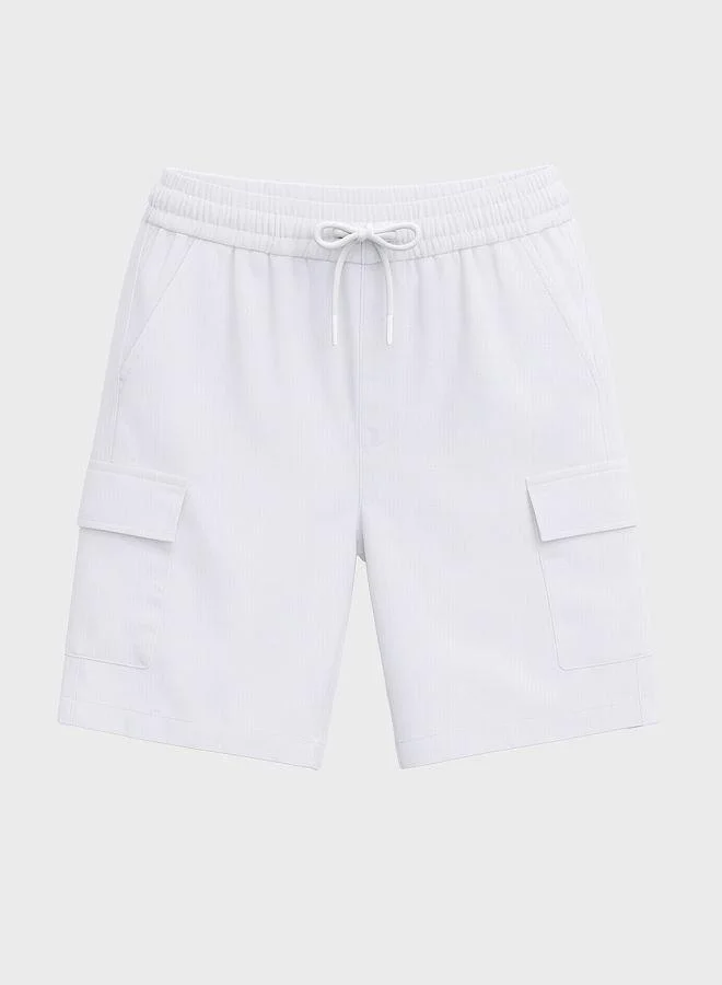 The Indian Garage Co  Men Relaxed Fit Solid Cargo Pocket Mid-Rise Cargo Shorts for Men | Best Price UAE